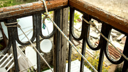 Rope knot connected on the iron balcony for hanging clothesの写真素材