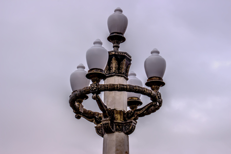 Night beautiful lamps under the clouds in the park of Baku.の写真素材