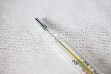 Thermometer with high temperature isolated on a white background