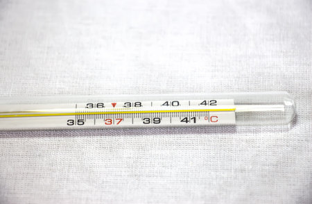 Thermometer with high temperature isolated on a white background