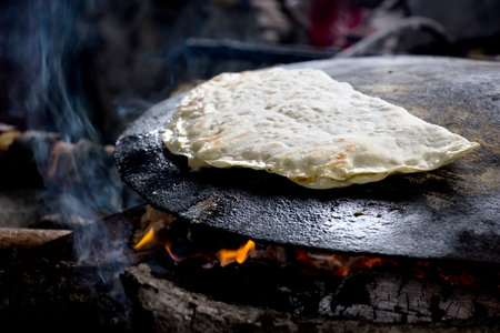 Azerbaijan national cuisine - kutabs in making. Gutab fry on fire