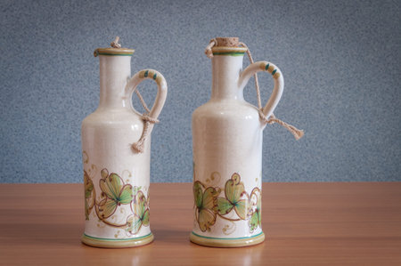 Bottles painted by hand on table with a gray backgroundの写真素材