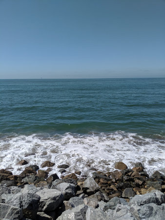 Waves Hitting the Rocks at the Beach