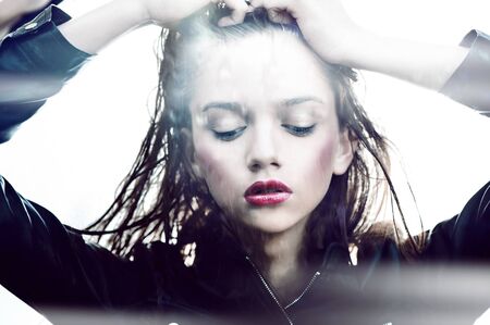 Sexy girl whith wet hair close eyes red lipsの写真素材