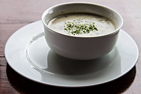 traditional polish mushroom soup with cream for christmas in white elegance dishwareの写真素材
