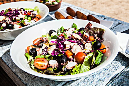 salad mix  from tomatoes of onions laid out on  plate
