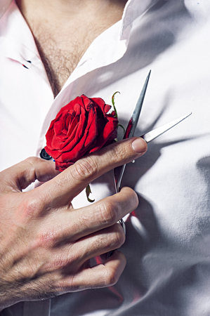bald fashion man face hairdresser whith red rose and scissorsの写真素材