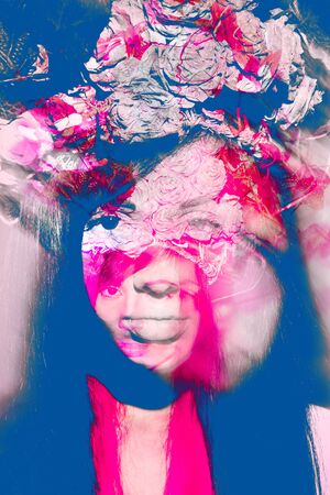 Fashion model with flowers in hairの写真素材