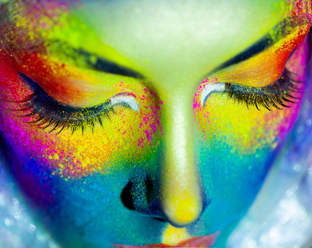 Beautiful fashion woman with color art makeupの写真素材