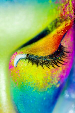 Beautiful fashion woman with color art makeupの写真素材