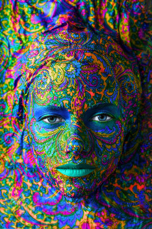 Beautiful fashion woman with color art makeup