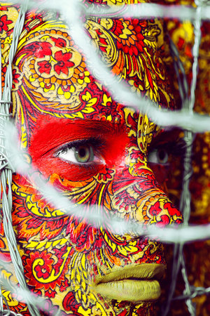 Beautiful fashion woman with color art makeupの写真素材