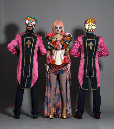 Two zombie men and dead lady posing on grey background in studioの写真素材