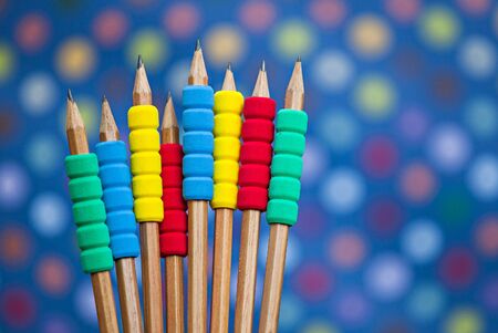 Row of color pencils on blue color  backgroundの写真素材