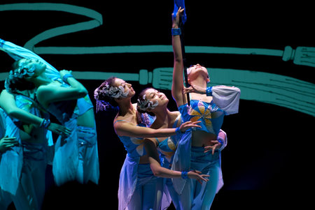 CHENGDU - DEC 9: HAIZHENG art troupe perform group dance "Sword Orchid" at JINCHENG theater in the 7th national dance competition of china.Dec 9,2007 in Chengdu, China.Choreographer: Zhang core, actors: 18のeditorial素材