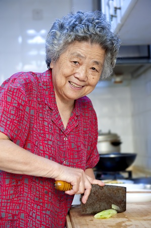 grandmother preparing to cookの写真素材