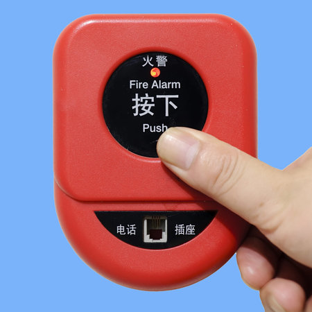 press fire alarm button with isolated background