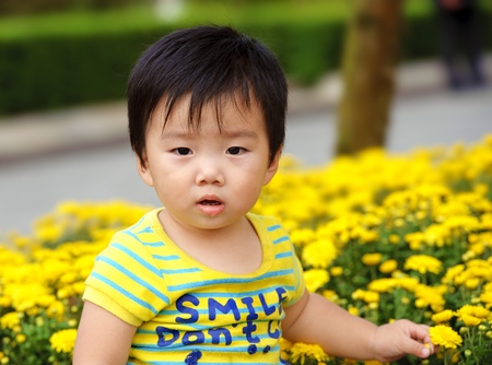 a cute baby  in gardenの写真素材