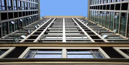 tilted building feature with sparkling glass curtain wall 