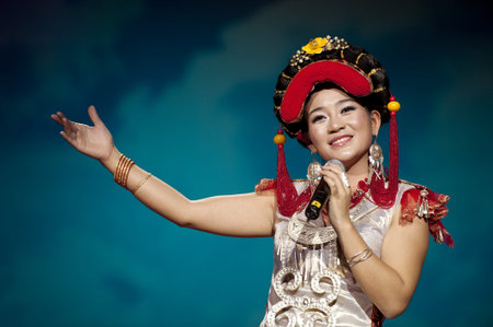CHENGDU - SEP 26: chinese Yi ethnic folk song performed by song and dance troupe of Liangshan Yi autonomous prefecture at JIAOZI theater in the 6th Sichuan minority nationality culture festival.Sep 26,2010 in Chengdu, China.のeditorial素材