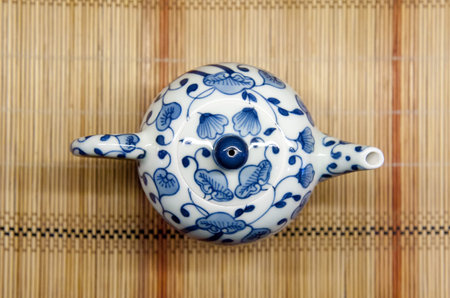 chinese teacup on straw matの写真素材