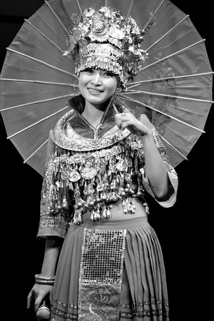 CHENGDU - SEP 28: chinese Miao ethnic singer performs on stage in the 6th Sichuan minority nationality culture festival at JINJIANG theater.Sep 28,2010 in Chengdu, China.のeditorial素材