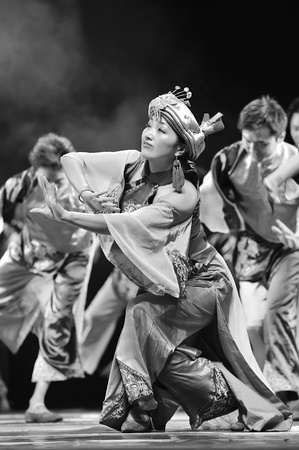 CHENGDU - SEP 28: chinese Qiang ethnic dancers perform on stage at Sichuan experimental theater.Sep 28,2010 in Chengdu, China.のeditorial素材
