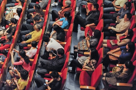 CHENGDU - APR 23: The audience watched the performance in the Concert Hall  on Apr 24,2011 in Chengdu,China.のeditorial素材