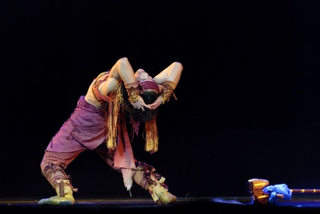 CHENGDU - DEC 14: Chinese Mongolian ethnic dancer performs solo dance on stage at Golden theater in the 7th national dance competition of china on Dec 14,2007 in Chengdu, China.のeditorial素材
