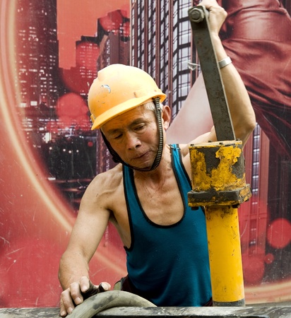 hardworking laborer on construction siteの写真素材
