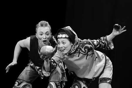 CHENGDU - DEC 12: chinese dancers perform folk duo dance on stage at JINCHENG theater in the 7th national dance competition of china on Dec 12,2007 in Chengdu, China.のeditorial素材