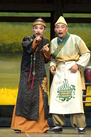 CHENGDU - JUN 7: Chinese Yue opera performer make a show on stage to compete for awards in 25th Chinese Drama Plum Blossom Award competition at Shengge theater.Jun 7, 2011 in Chengdu, China.Chinese Drama Plum Blossom Award is the highest theatrical awardのeditorial素材