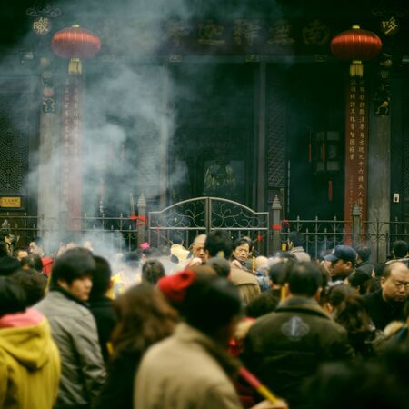 CHENGDU - FEB 14: People burning incense upon the incense altar in temple during chinese new year on Feb 14, 2010 in Chengdu, China. It is part of the important traditional custom in China. のeditorial素材