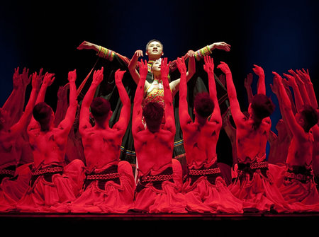 CHENGDU - DEC 13: Chinese ethnic dancers perform group dance on stage at JINCHENG theater in the 7th national dance competition of china on Dec 13,2007 in Chengdu, China.のeditorial素材