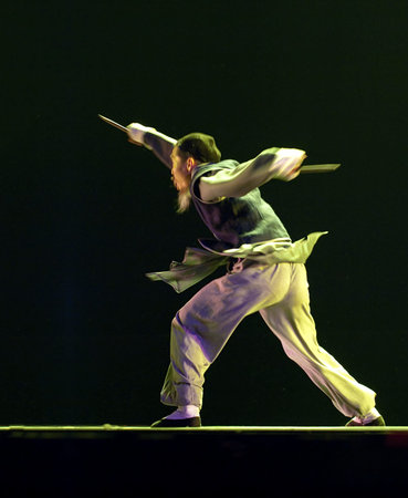 CHENGDU - DEC 12: modern dancer performs solo dance on stage at JINCHENG theater.Dec 12,2007 in Chengdu, China.Choreographer: Wang Tianyou, Cast: Wu Haoのeditorial素材