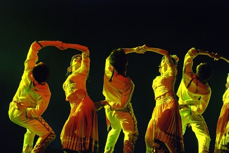 CHENGDU - DEC 15: Chinese ethnic dancers perform group dance on stage at JINCHENG theater in the 7th national dance competition of china on Dec 15,2007 in Chengdu, China.のeditorial素材