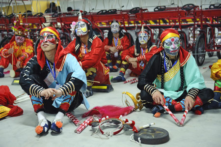 CHENGDU - MAY 29: Chinese Puning Yingge folk dancers resting in the 3rd International Festival of...