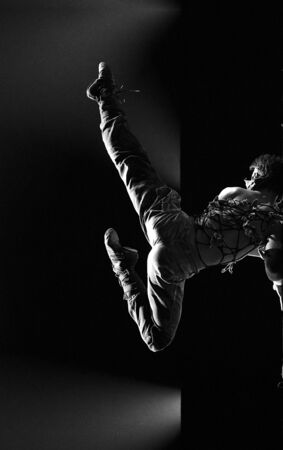 CHENGDU - DEC 12: modern dancer performs solo dance on stage at JINCHENG theater.Dec 12,2007 in Chengdu, China.Choreographer: Liu Tingting, actor: Fan Leiのeditorial素材