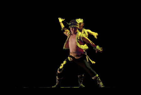 CHENGDU - DEC 11: Mongolian ethnic dancers perform duo dance on stage at JINCHENG theater in the 7th...