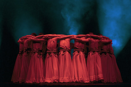 CHENGDU - DEC 13: Chinese ethnic dancers perform group dance on stage at JINCHENG theater in the 7th...
