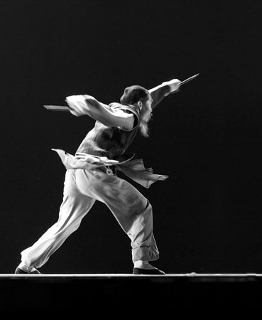 CHENGDU - DEC 12: modern dancer performs solo dance on stage at JINCHENG theater.Dec 12,2007 in Chengdu, China.Choreographer: Wang Tianyou, Cast: Wu Haoのeditorial素材
