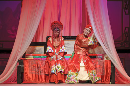 CHENGDU - JUN 3: chinese Yue opera performer make a show on stage to compete for awards in 25th Chinese Drama Plum Blossom Award competition at Experimental theater.Jun 3, 2011 in Chengdu, China.Chinese Drama Plum Blossom Award is the highest theatrical のeditorial素材