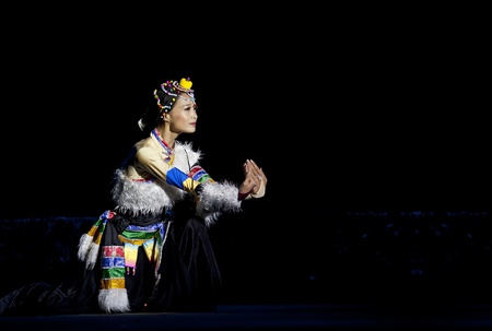 CHENGDU - SEP 28: chinese Tibetan ethnic dancer performs on stage in the 6th Sichuan minority nationality culture festival at JINJIANG theater.Sep 28,2010 in Chengdu, China.のeditorial素材