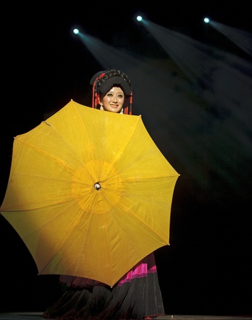 CHENGDU - SEP 26: chinese Yi ethnic dancer performs on stage at JIAOZI theater.Sep 26,2010 in Chengdu, China.のeditorial素材