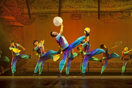 CHENGDU - OCT 17: Chinese national dancers perform folk dance on stage at JINCHENG theater on Oct 17, 2011 in Chengdu, China.のeditorial素材