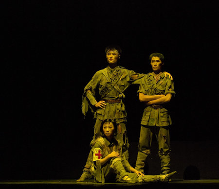 CHENGDU - DEC 14: Chinese dancers perform modern trio dance on stage at Golden theater in the 7th...