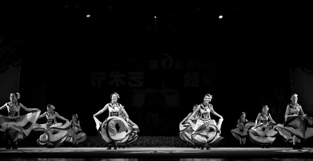 CHENGDU - SEP 28: chinese Yi ethnic dancers perform on stage in the 6th Sichuan minority nationality culture festival at JINJIANG theater.Sep 28,2010 in Chengdu, China.のeditorial素材
