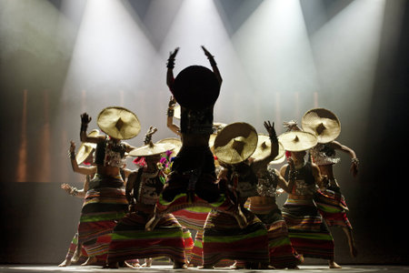 CHENGDU - OCT 27: chinese national dancers perform traditional dance Dynamic Yunnan on stage at Jincheng theater.Oct 27, 2011 in Chengdu, China.のeditorial素材