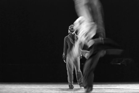 CHENGDU - DEC 9: Modern dancers perform duo dance on stage at JINCHENG theater in the 7th national dance competition of china.Dec 9,2007 in Chengdu, China.のeditorial素材