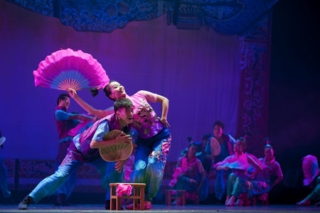 CHENGDU - OCT 17: Chinese national dancers perform folk dance on stage at JINCHENG theater on Oct...
